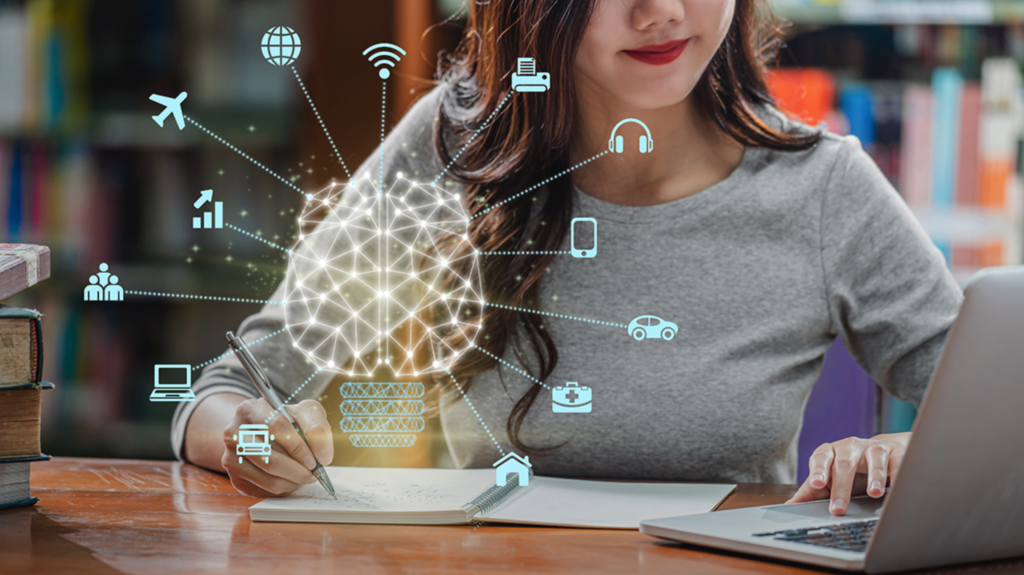 Woman working on laptop with hologram of technology and AI symptoms around